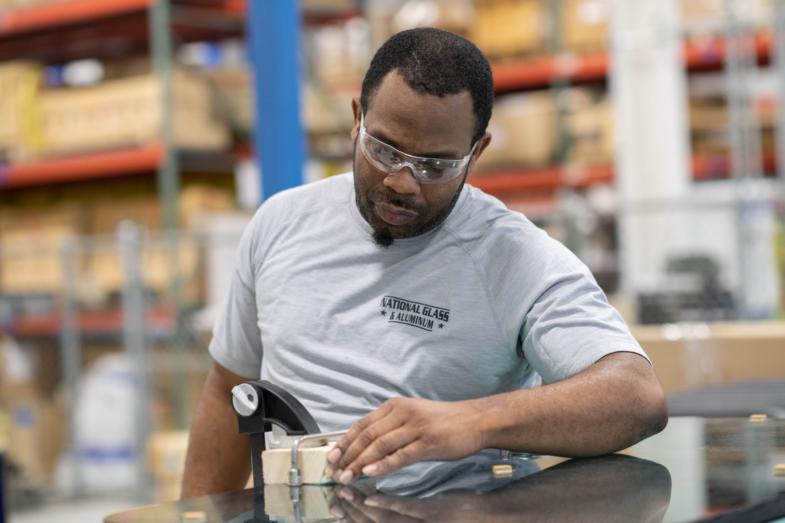 Man woodworking in safety glasses