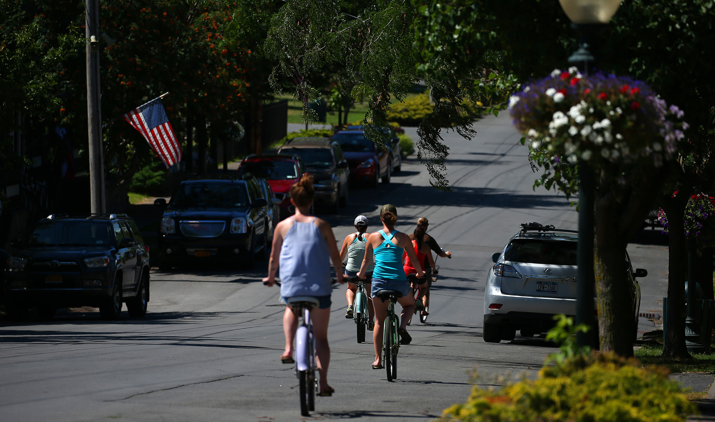 People biking in a neighborhood