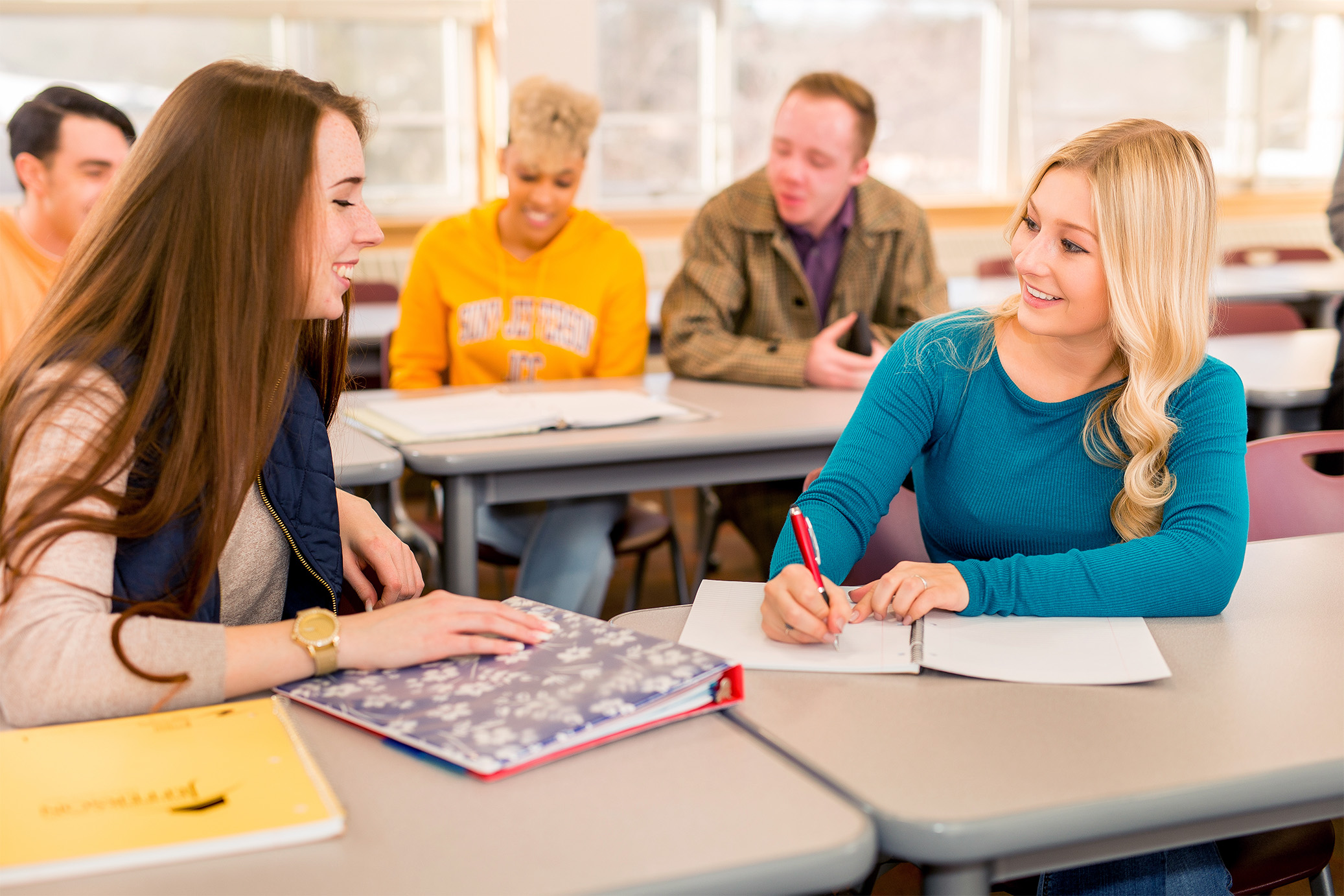 Students chatting at desks