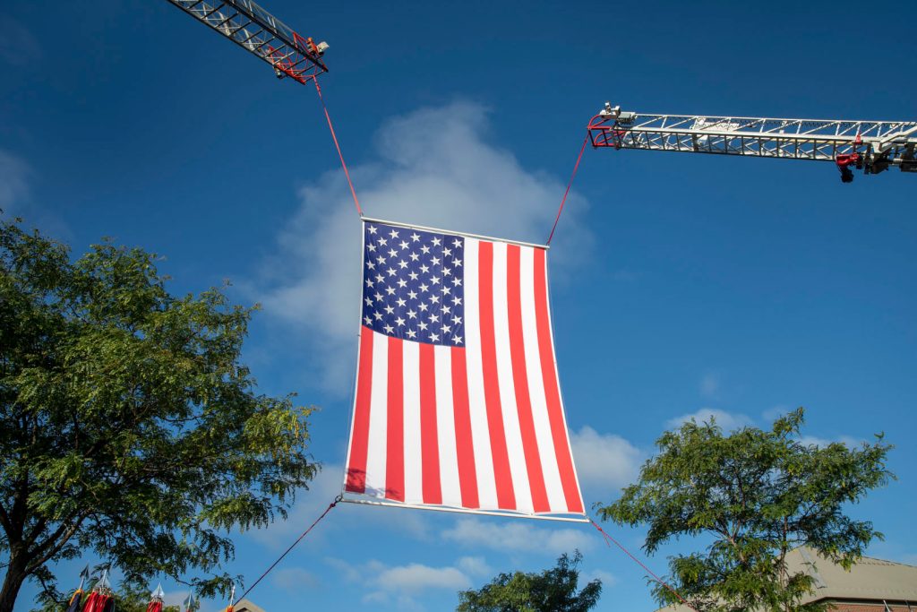 American flag being floated in sky